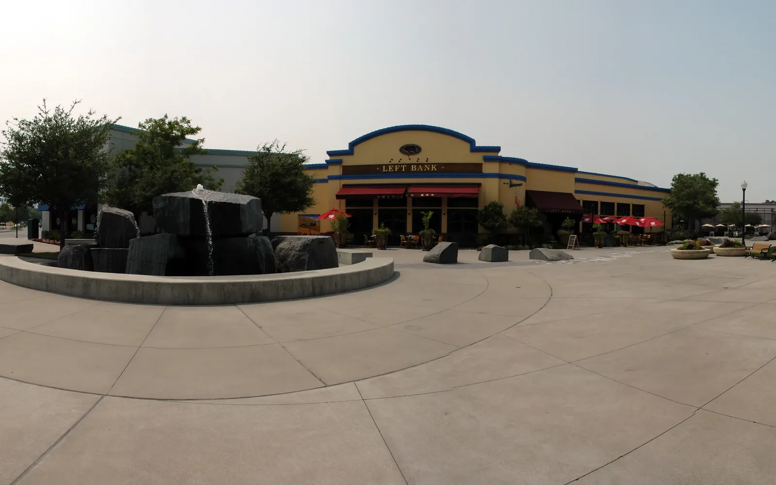 Panoramic view of downtown Pleasant Hill showing street-level retail and pedestrian areas on a smoky afternoon